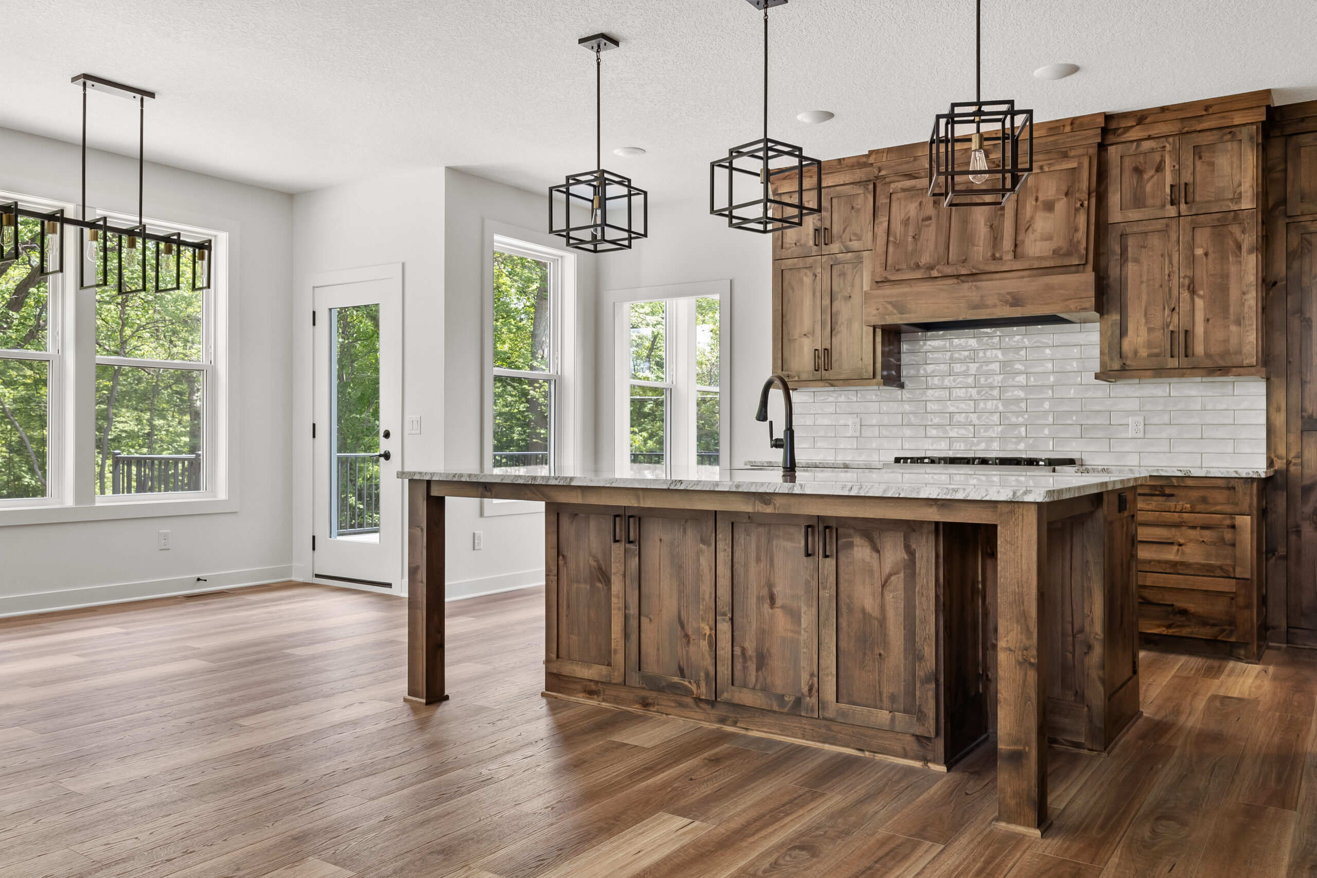 Knotty-alder kitchen with geometric pendant lighting — The Juniper