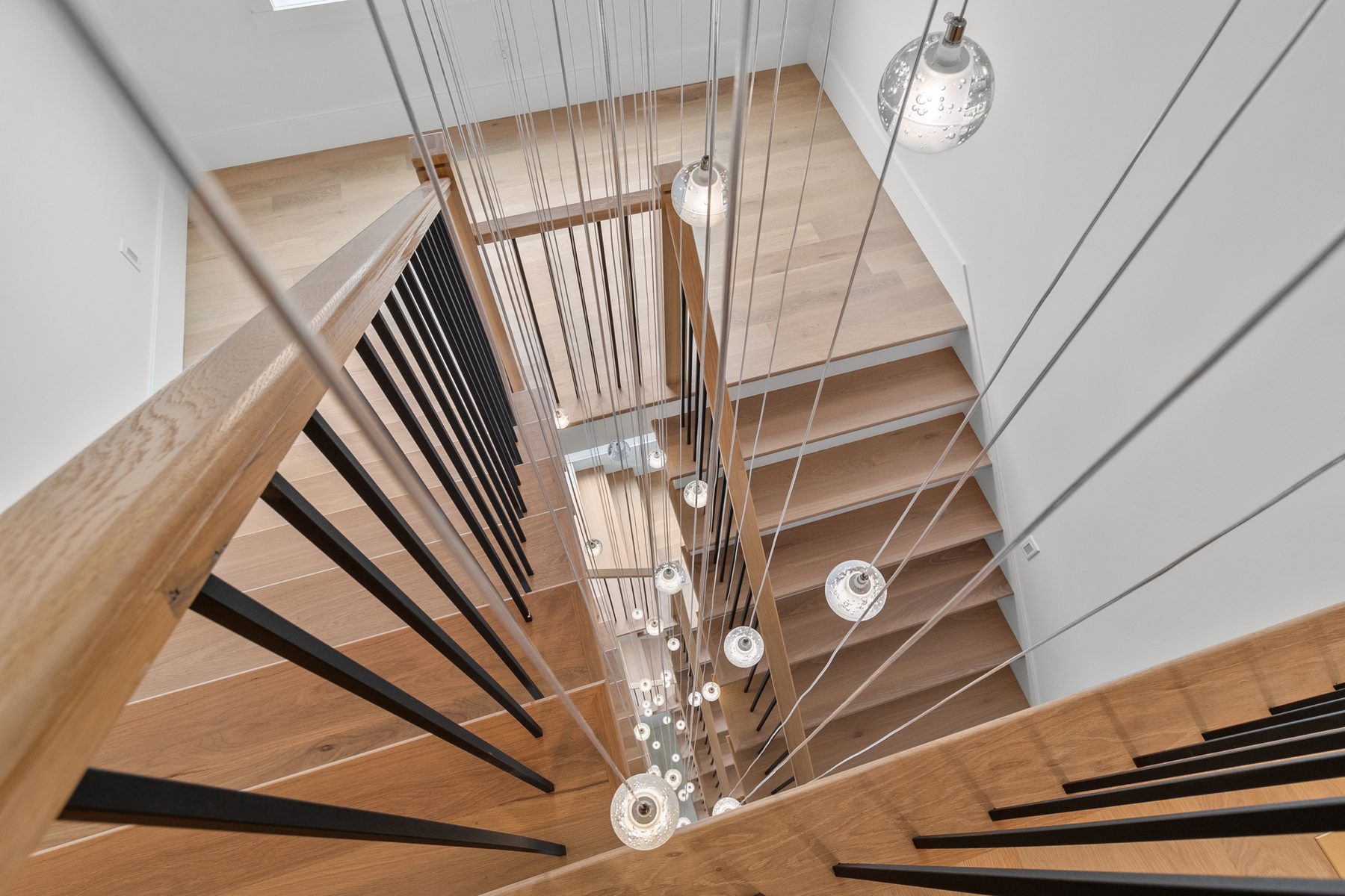 A sculptural floating staircase showcasing JPC craftsmanship