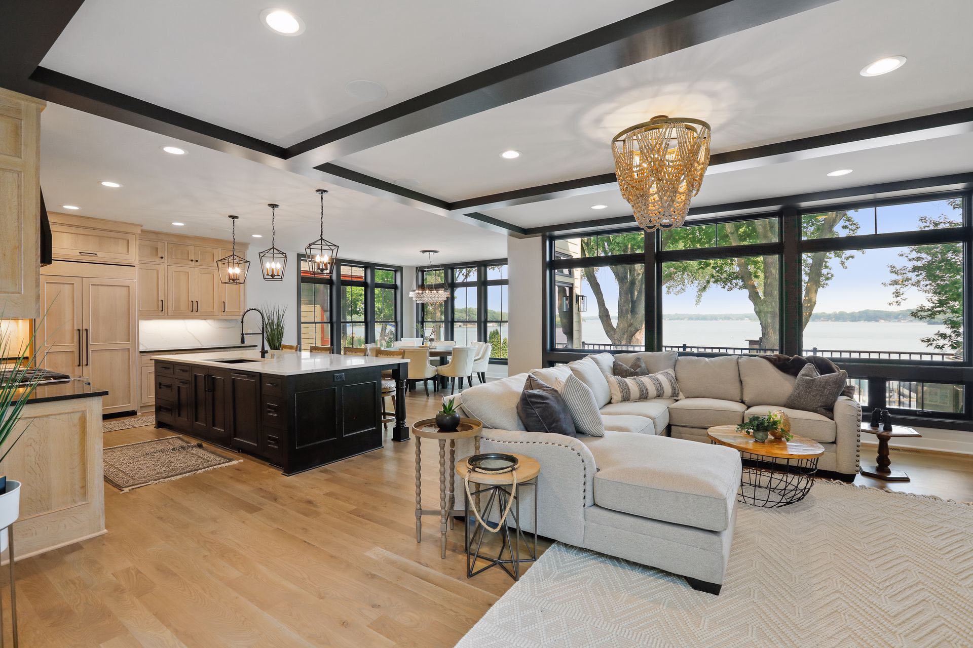 Lakefront great room with floor-to-ceiling windows over the water