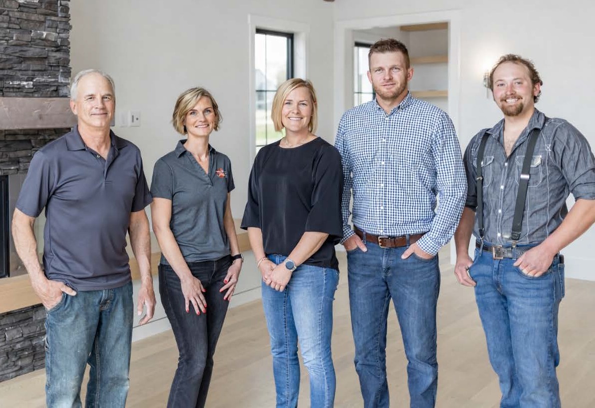 The JPC Custom Homes team standing together inside a finished custom home